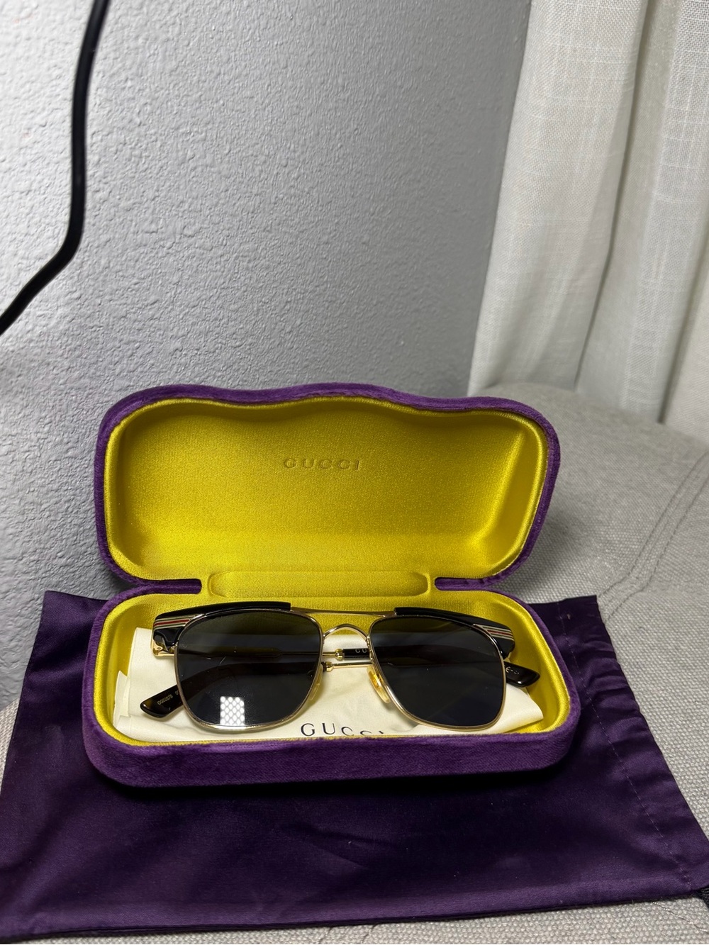 Gucci Black Lensed Sunglasses with Gold-Tone Frame